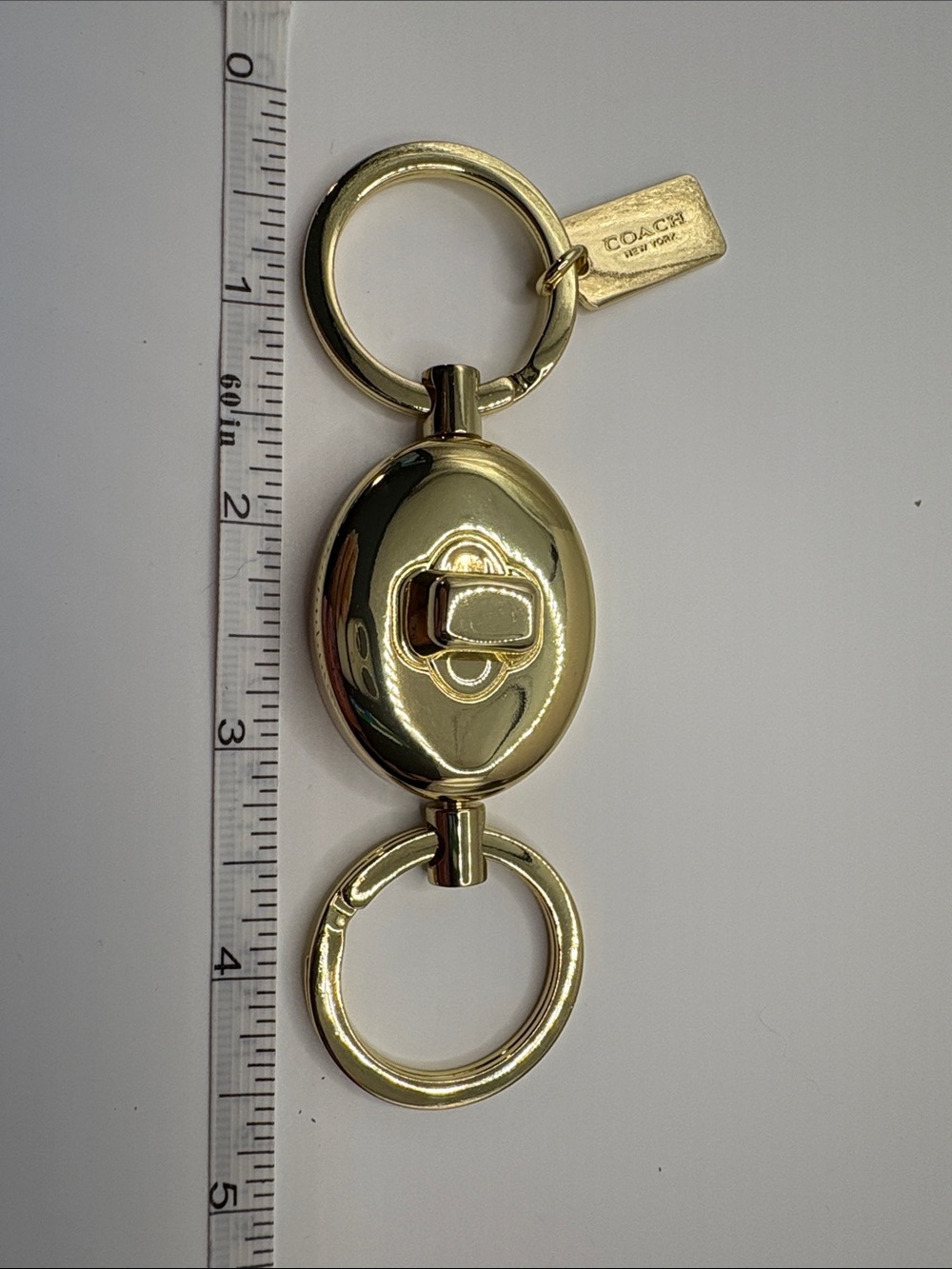 Coach Gold-Tone Oval Valet Large Key Holder with Signature Tag
